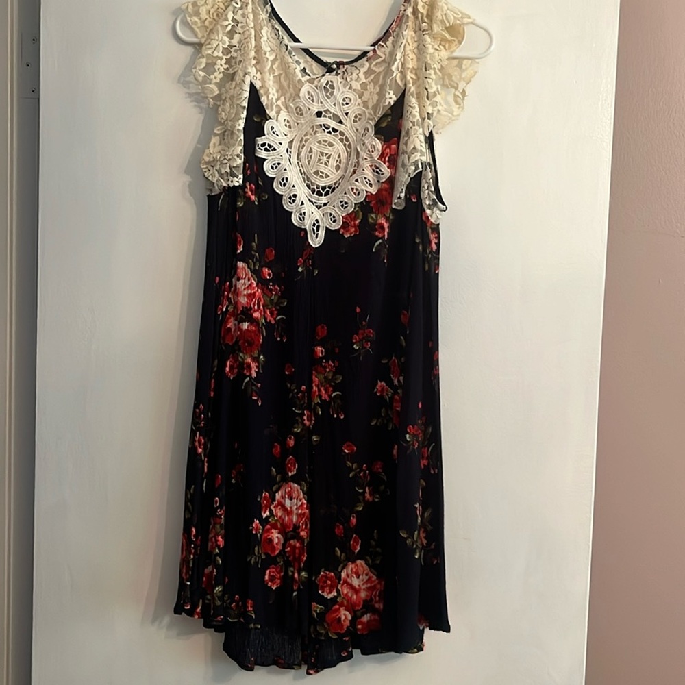 Medium dress with flutter sleeves and cute keyhole back.